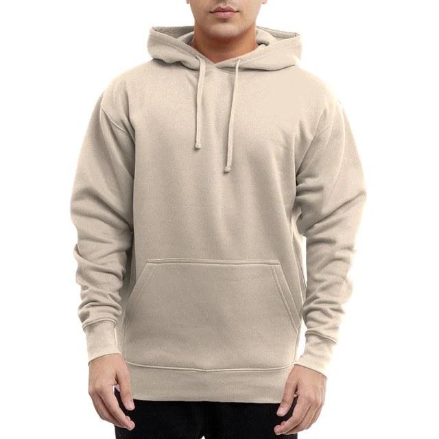 Man wearing a cream-colored pullover hoodie sweatshirt with a kangaroo pocket and drawstring hood
